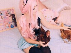 Belle Delphine strokes two BIG cocks gif