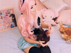 Belle Delphine strokes two BIG cocks gif