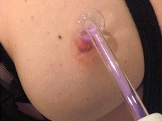 Electric Shock Wand on Nipple of Tied Up Blonde gif