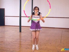 Cheerleader flashes panties while hula hooping gif