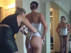 Tying Helena Price's bridal corset gif