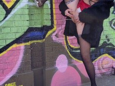 girl pissing on the wall gif