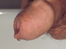 Watching himself piss makes uncut guy's hoofded cockhead swell 0025-1 10 gif